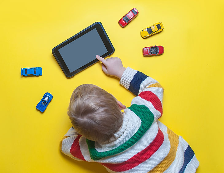 Envy-Boutique-Travel-Blog-Boy-With-Toys
