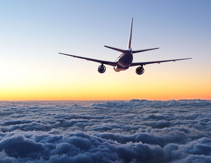Envy-Boutique-Travel-Blog-Plane-Flying-short-Flight-In-Sky