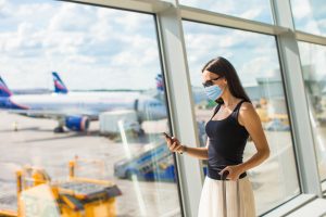 Woman,Wearing,A,Mask,For,Prevent,Virus,With,Baggage,In International Travel